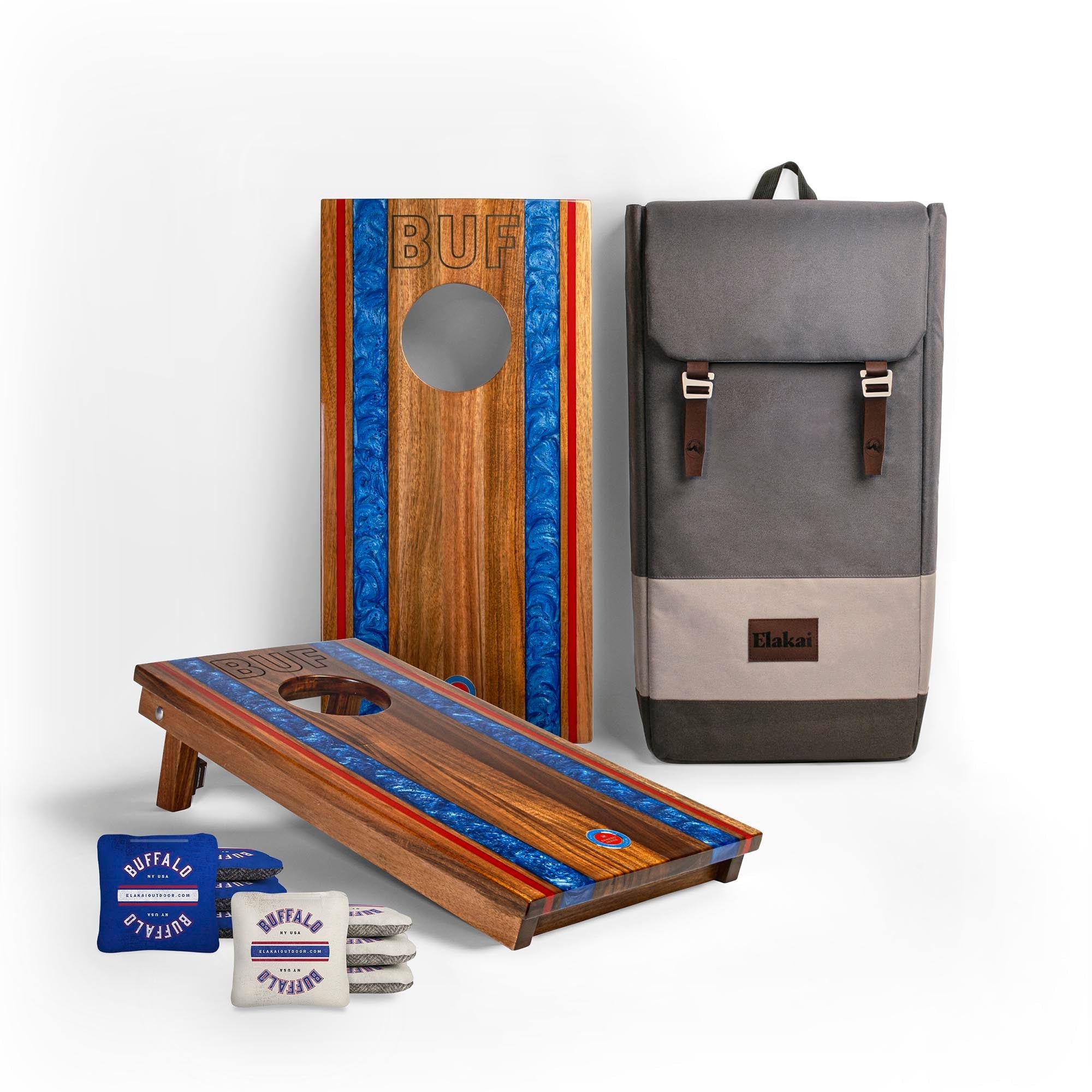 Two wooden cornhole boards with blue and red stripes, a gray backpack, and small bags on a white background.
#color_buffalo