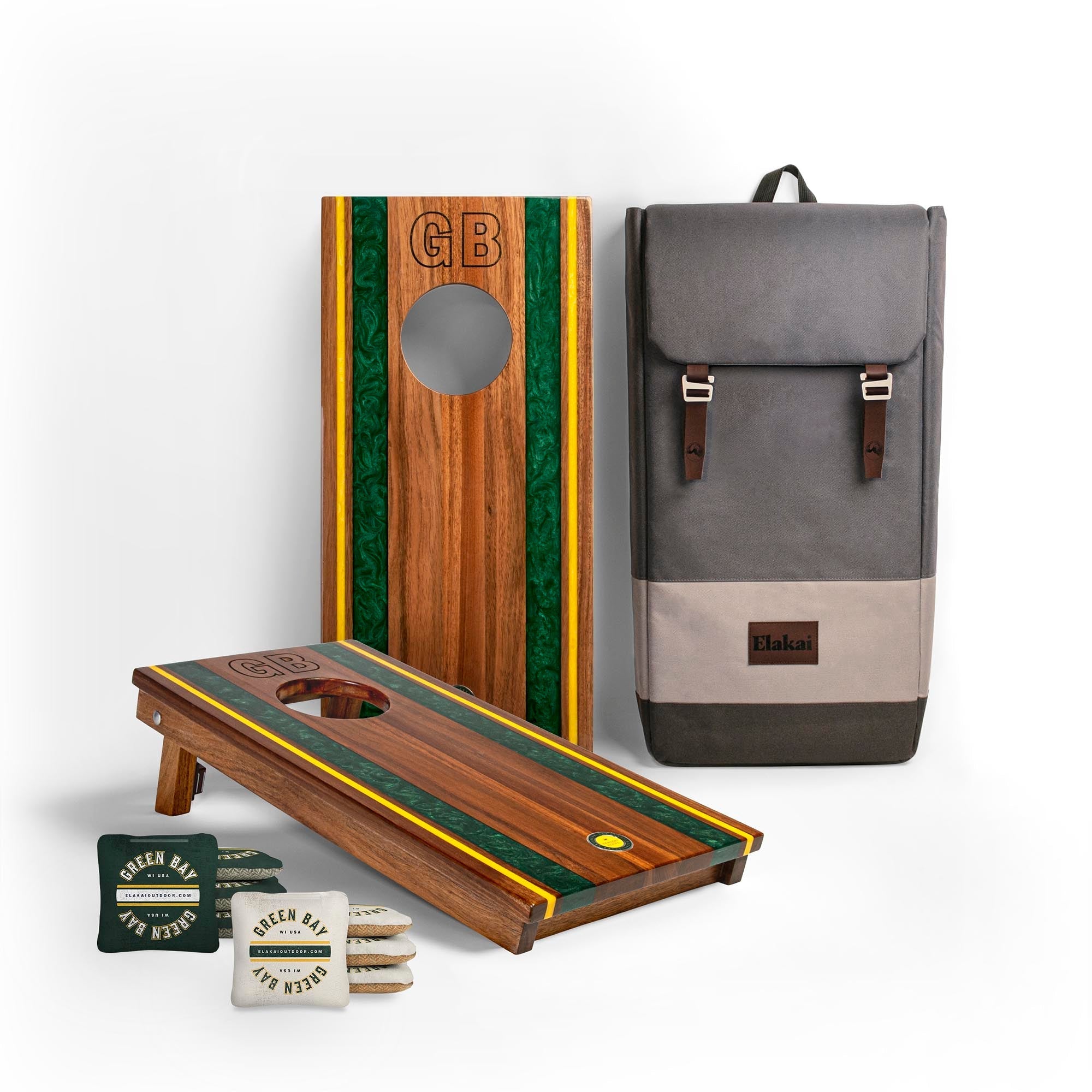 Wooden cornhole boards with green and yellow stripes, a gray backpack, and bags on a white background
#color_green bay