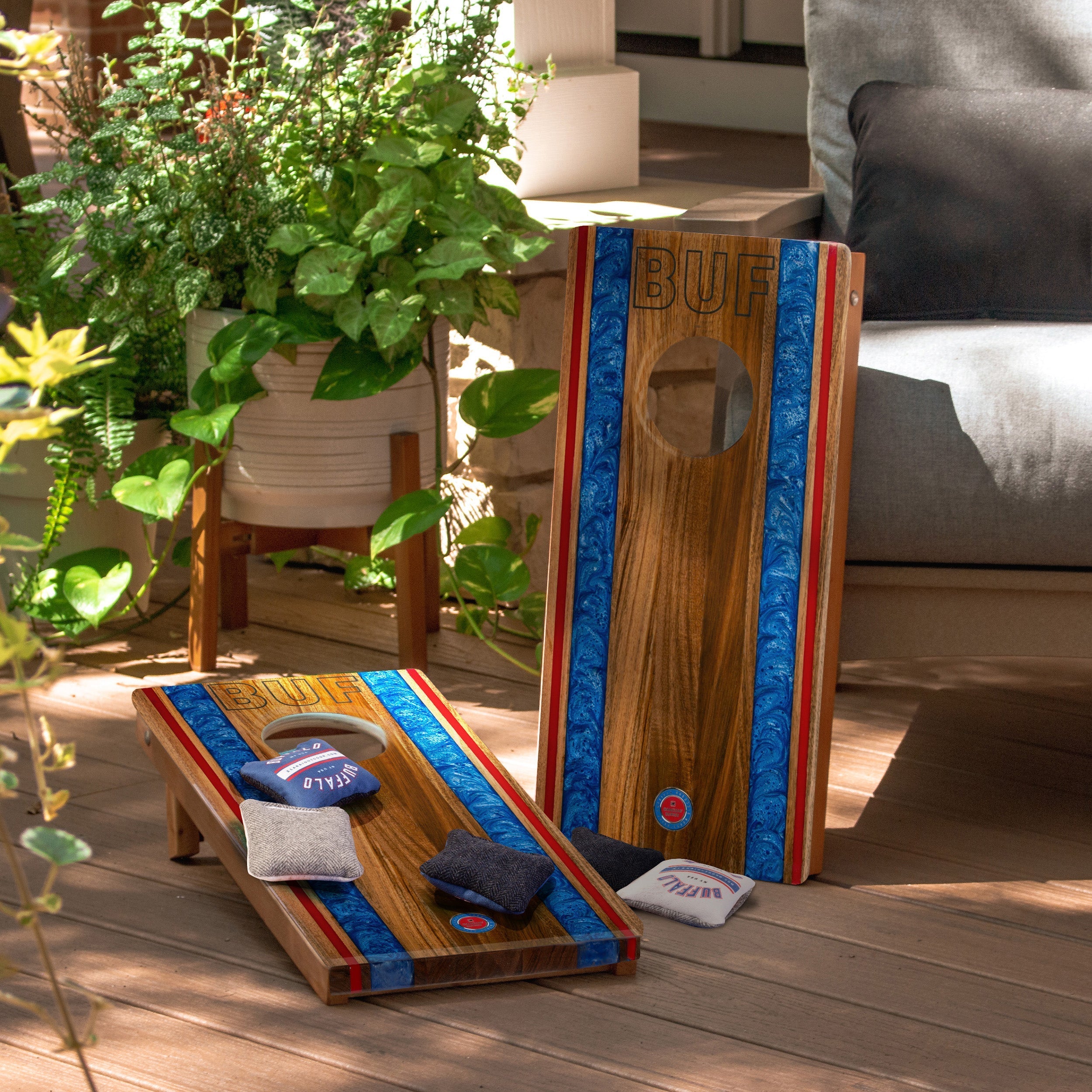 Wooden cornhole boards with bags on a wooden deck
#color_buffalo