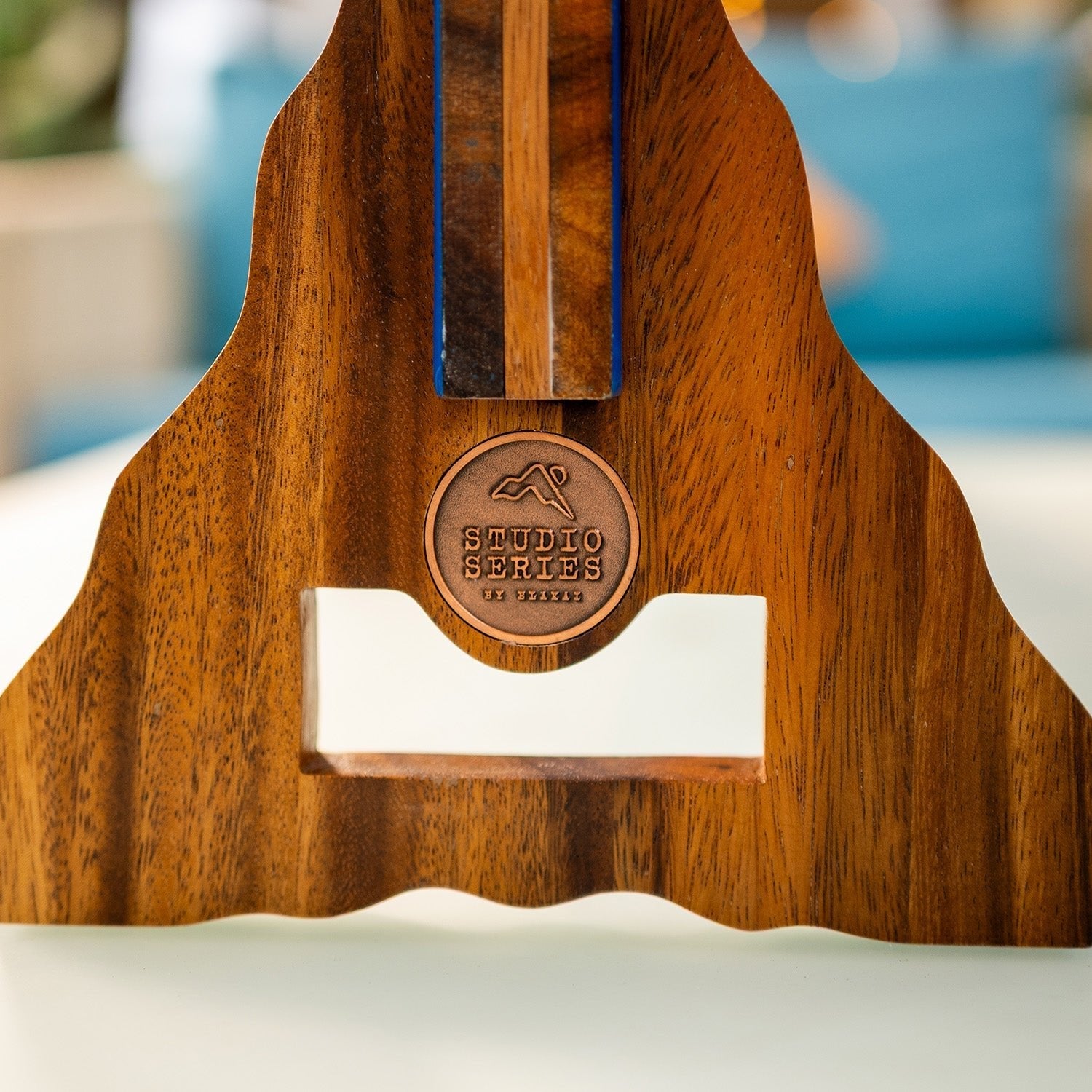 Solid acacia stand with engraved copper Studio Series by Elakai medallion on the Beach Resin giant 4 in a row game