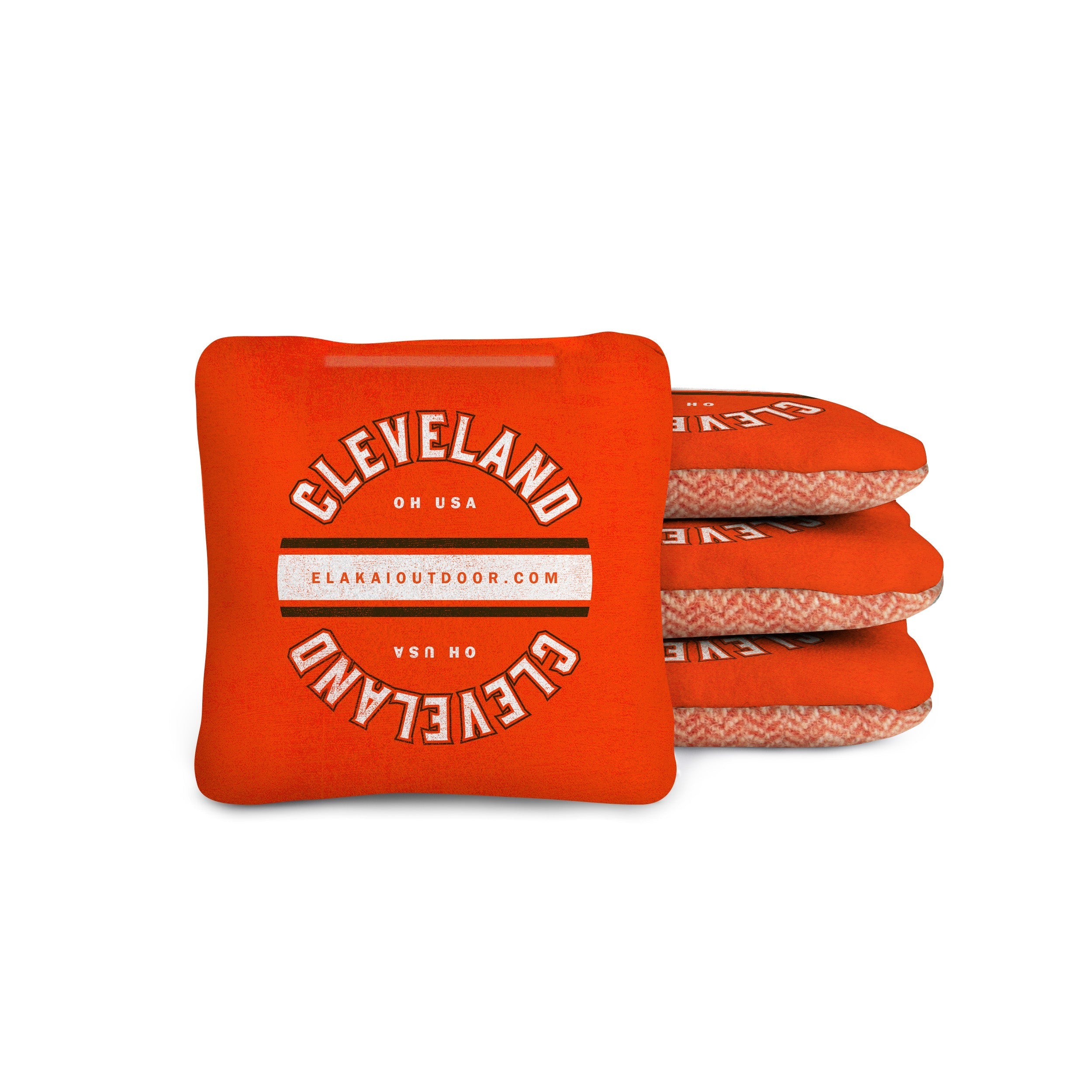 Stack of orange cornhole bags with 'Cleveland OH USA' text on a white background

#color_cleveland